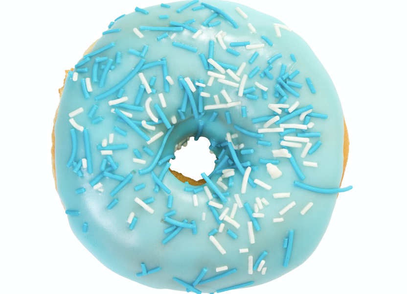 A delicious donut topped with vibrant light blue frosting, colored with BioconColors natural blue colorant derived from Spirulina or Huito.